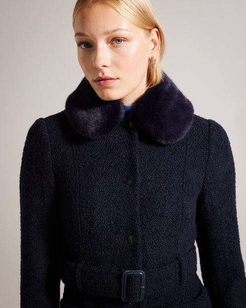 LYDDIIA-Outerwear-Introducing the ultimate cosy coat. LYDDIIA is your stylish shield against the elements. Slip into the regular fit adorned with faux fur cuffs and collar for an extra touch of glam. The button fastening and belted waist create a chic silhouette, while pockets keep your hands toasty. Longline coat Regular fit Faux fur cuffs and collar Button fastening Belted waist Pockets Jara is 5'10.5" / 1.79m and wears Dark Blue in a Ted size 1- Ted Baker Romania